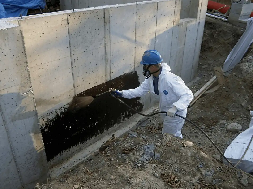 Professional waterproofing the exterior walls of the basement in Fort Wayne, IN