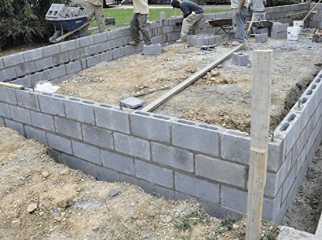 Professionals building a foundation with blocks in Fort Wayne, IN