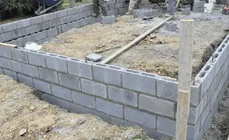 Professionals building a foundation with blocks in Fort Wayne, IN