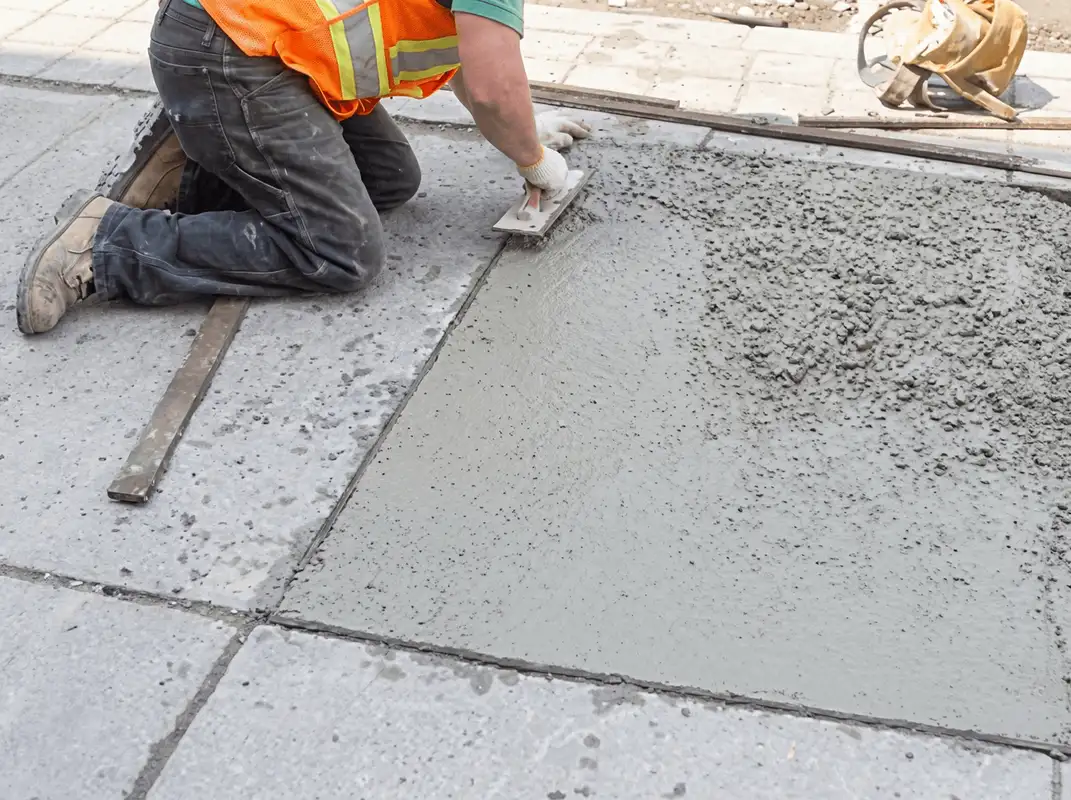 Professional repairing a concrete floor in Fort Wayne, IN