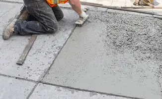 Professional repairing a concrete floor in Fort Wayne, IN