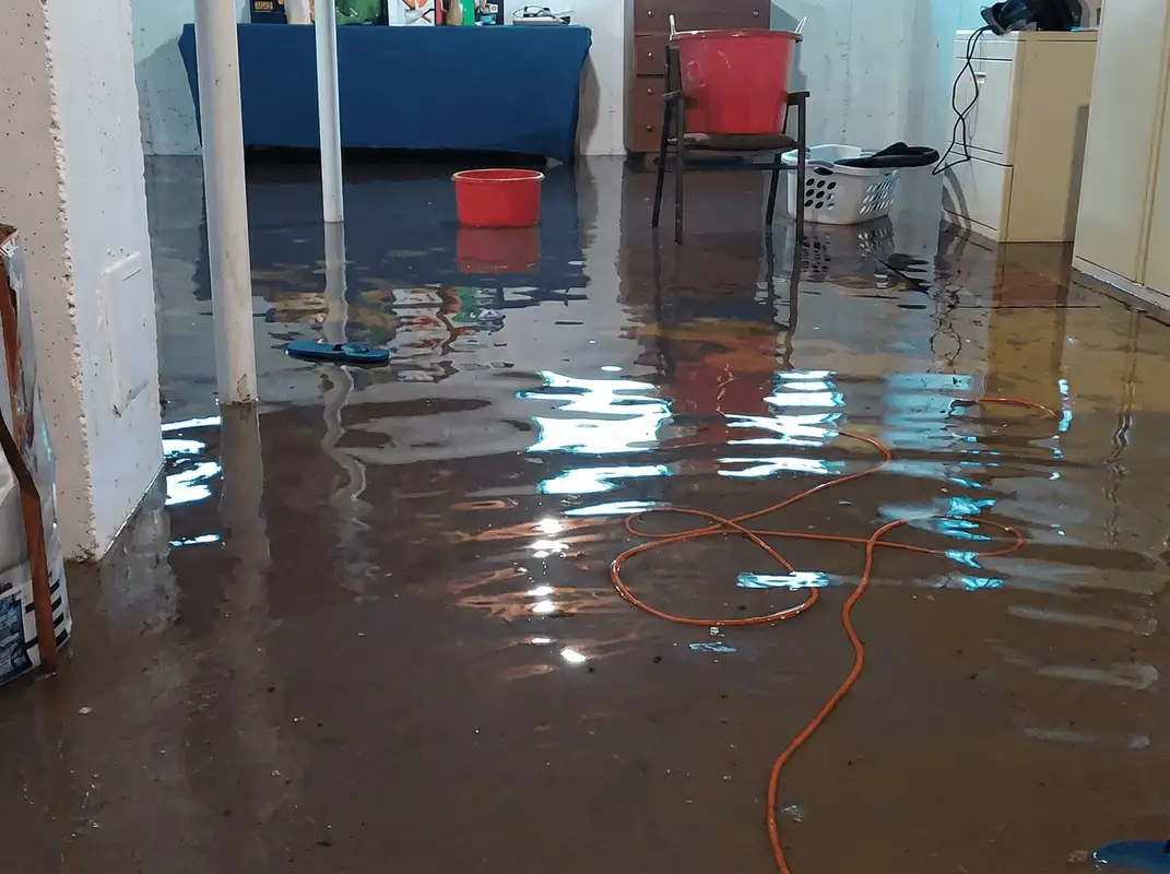 Basement with boiler, cabinets and washing machine completely flooded in Fort Wayne, IN